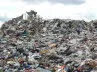 A compactor working on the daily waste cell