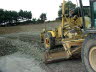 Grader with auto laser levelling