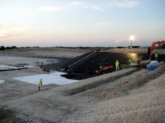 A Landfill cell being geomembrane lined.