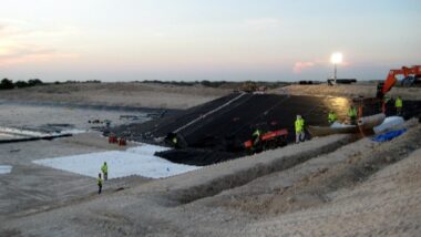 A Landfill cell being geomembrane lined.